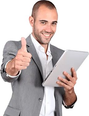 Smiling man in a grey suit giving a thumbs-up while holding a tablet